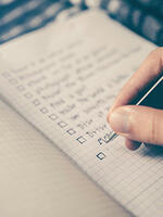 A white person writing a to do -list. Image: Glenn Carstens-Peters / Unsplash